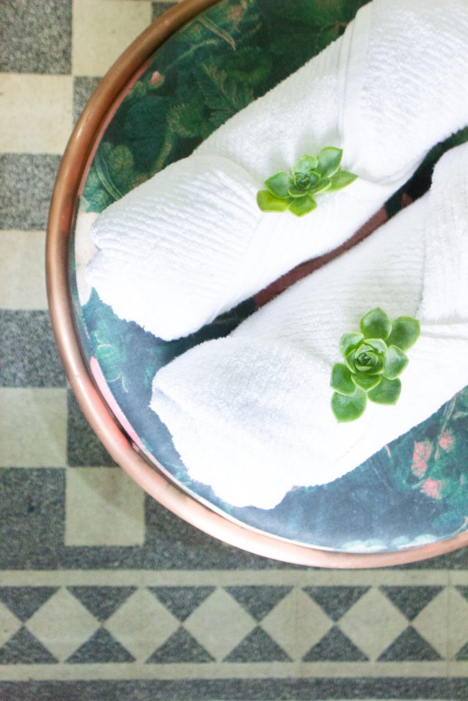 Bright, comfortable guest room with luxury bedding